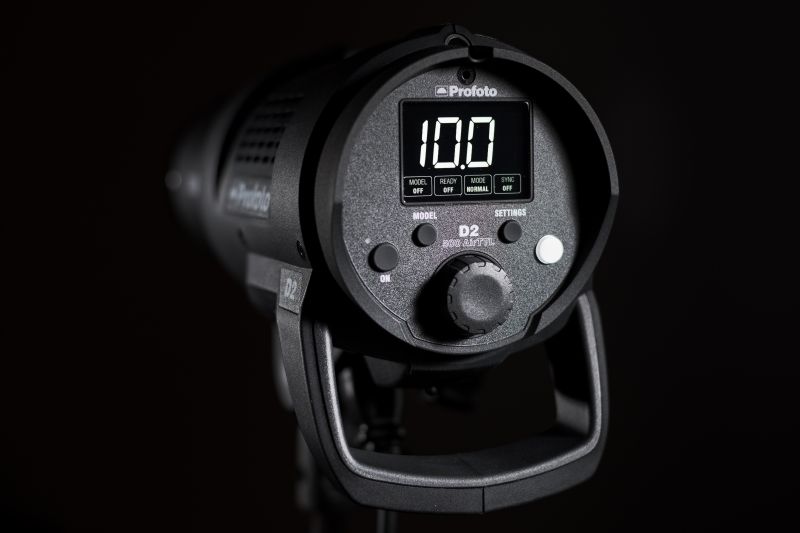 reverse side of profoto d2 flash head on dark background. profoto head is perfect for product photography