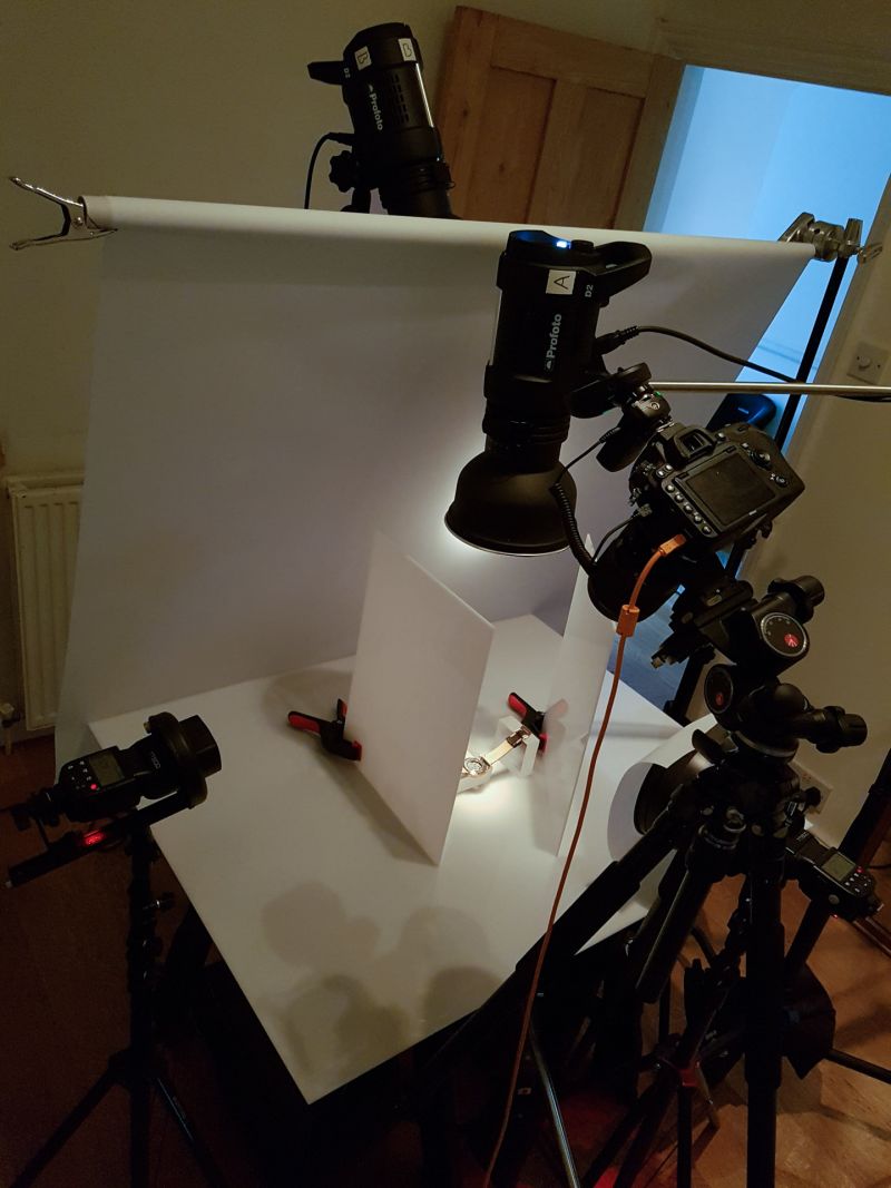 behind the scene image of watch being photographed by product photography Max Bridge. Image shows a mix of speedlights and strobes being used