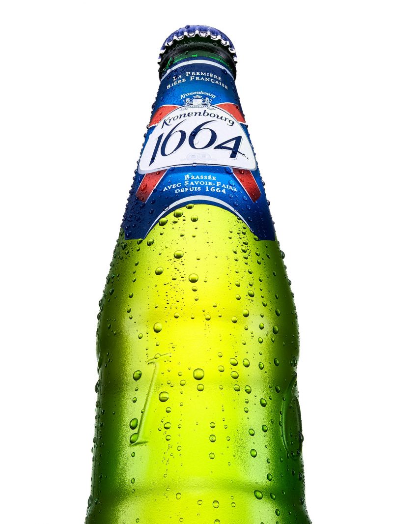 a low angle photo of a bottle of Kronenbourg used to demonstrate the number of megapixels needed for still life photography