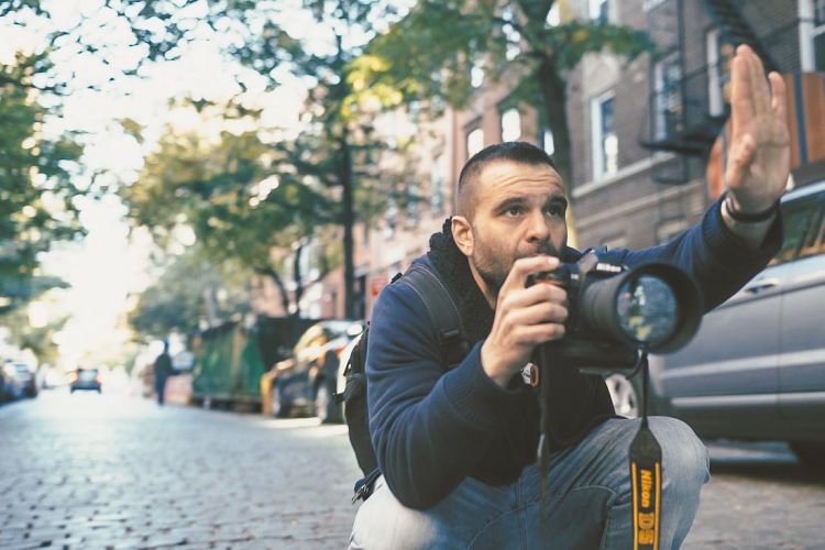 NYC Branded Lifestyle Portrait - DeMato shooting and directing with hand