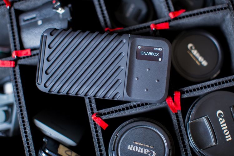 Gnarbox 2.0 on top of gear in a camera bag