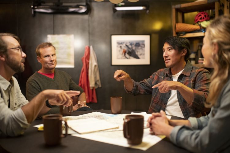 Jimmy Chin leads a pre-shoot meeting with colleagues