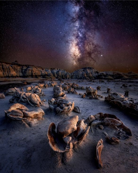 “Alien Eggs” – Debbie Heyer

Badlands of New Mexico, USA

The Badlands of New Mexico are otherworldly and mysterious. They resemble an alien planet. If you don’t believe in aliens, you will after seeing this place. This is not an easy terrain to navigate, and it is very easy to get lost. Luckily, my friends knew the area well, and we could enjoy this photographer’s paradise of endless compositions that blew my mind!
This was shot last October on a two-week photo tour with friends through the Southwest. It was the best way to end the Milky Way season.