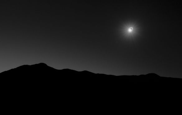 145 Seconds of Darkness © Filip Ogorzeski (Poland) - RUNNER-UP
This image was captured during the total solar eclipse seen on 2 July 2019. The photographer travelled 13,000 kilometres from Poland to Chile to see the total solar eclipse. His plan was to create the most minimalist picture of this breath-taking event and capture the brief moment when nature freezes; the birds fly to their nests and the temperature drops during 145 seconds of darkness.
Fujifilm X-T2 camera, Carl Zeiss Touit Planar 32 mm f/1.8 lens at f/5.6, ISO 400, 1/90-second exposure